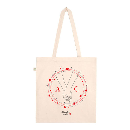 Tote bag personalizada con ilustración de manos cogidas rodeadas de corazones para parejas enamoradas