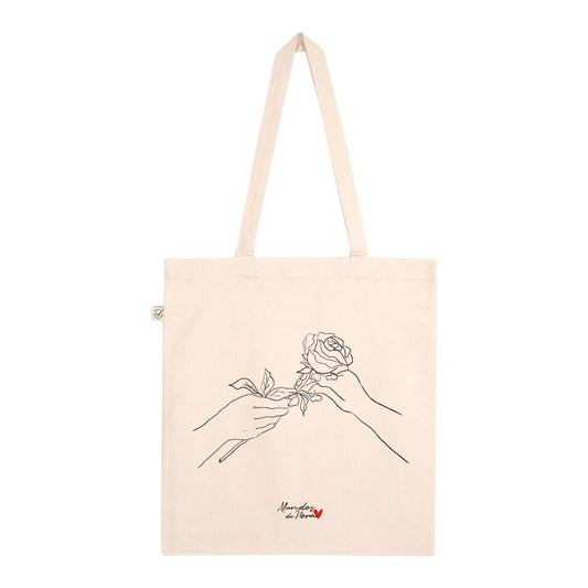 Tote bag  con diseño de mano regalando una rosa: el regalo perfecto para tu pareja